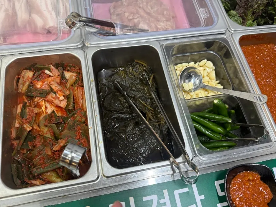 Self-serve bar fully stocked with side dishes