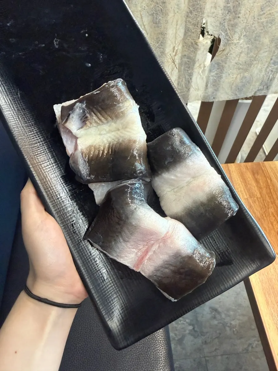 Chicken neck and eel tail grilling on the grate