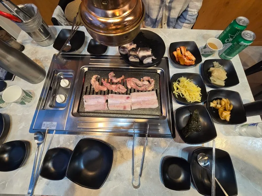 Eel and chicken neck meat cooking to a golden brown