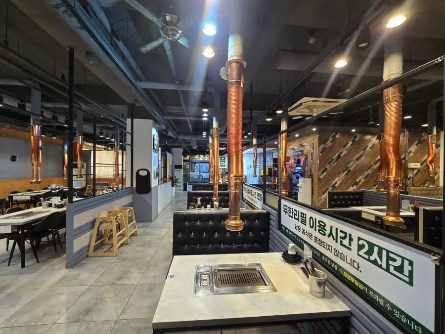 View of the dining hall tables at Songrimbok Jangeo Daejeon Direct Store