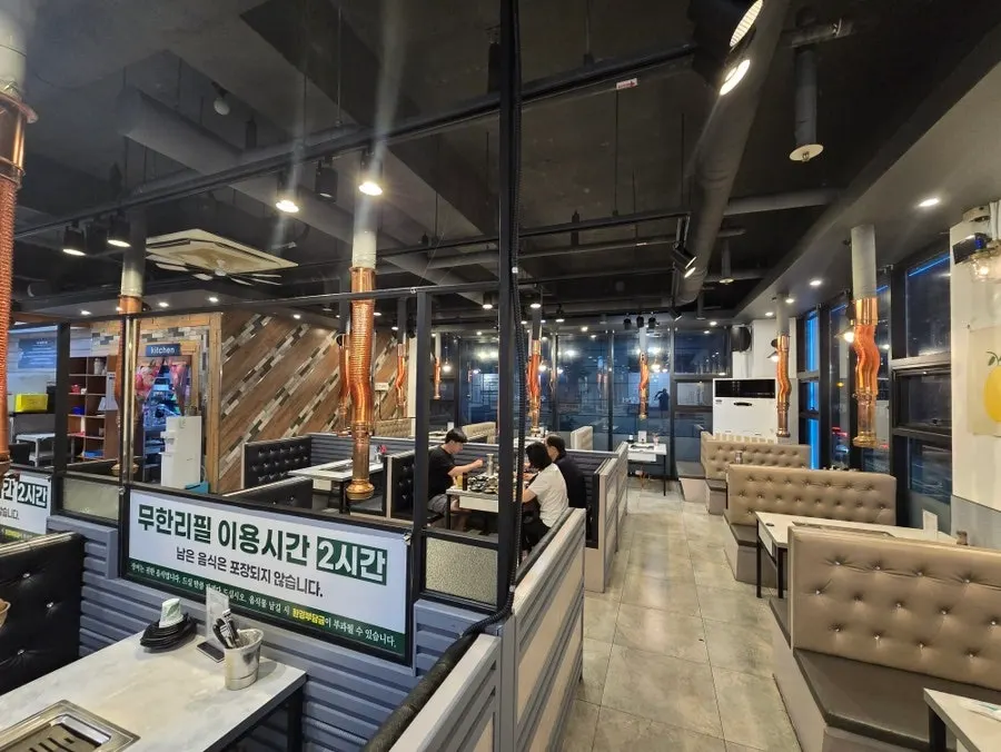 View of the dining hall tables on the opposite side from the kitchen