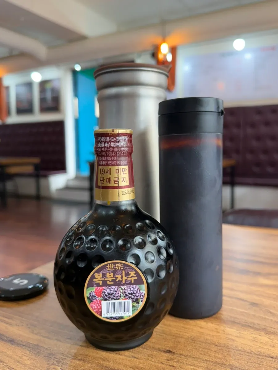 Complimentary bokbunja wine served with the meal