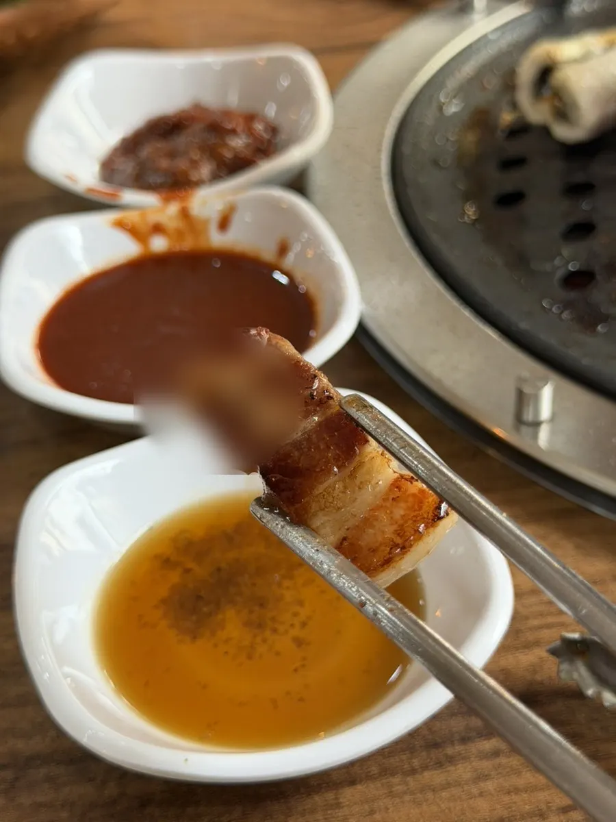 Domestic duck neck meat grilled over charcoal