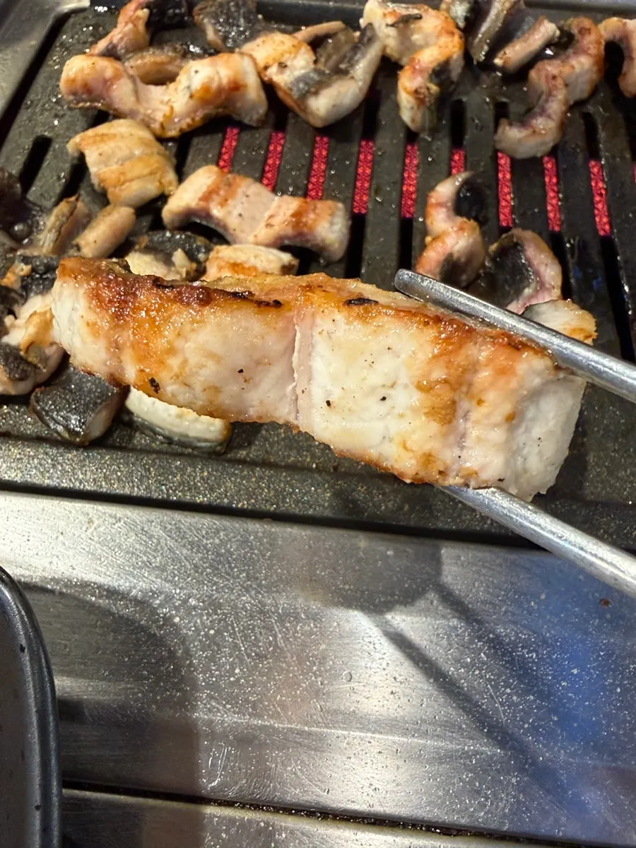 Freshwater eel cooking on the grill
