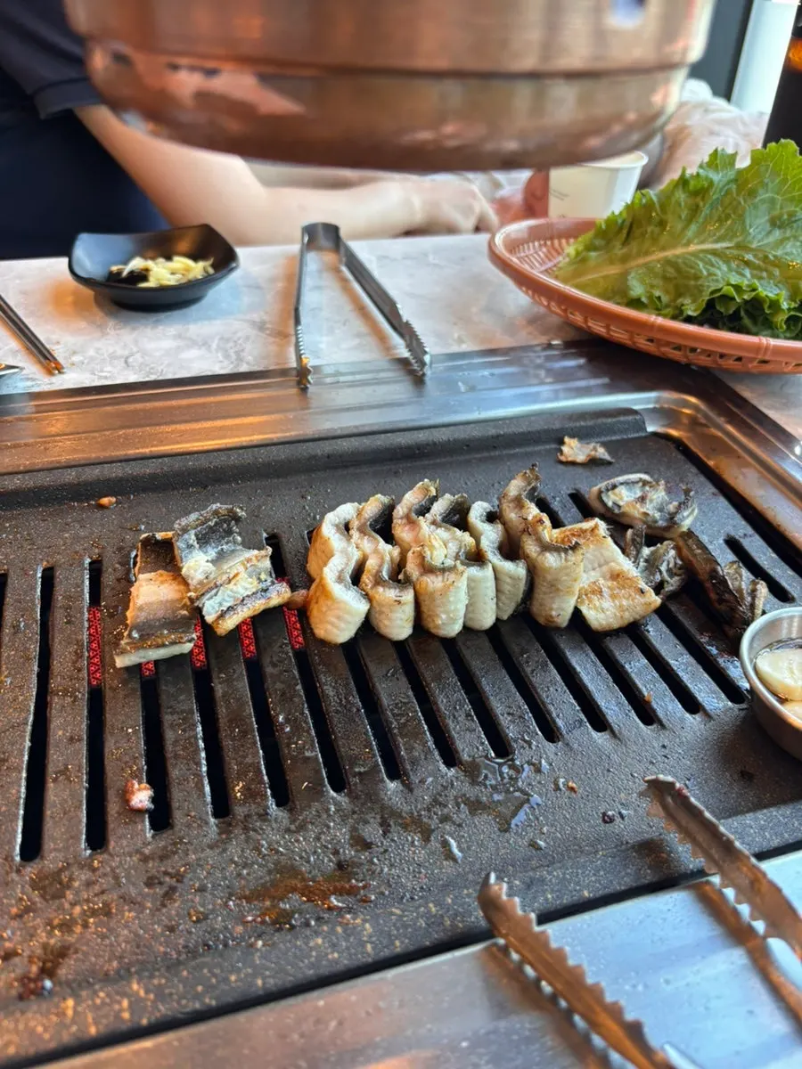 A piece of pork belly and chicken neck meat cooked first