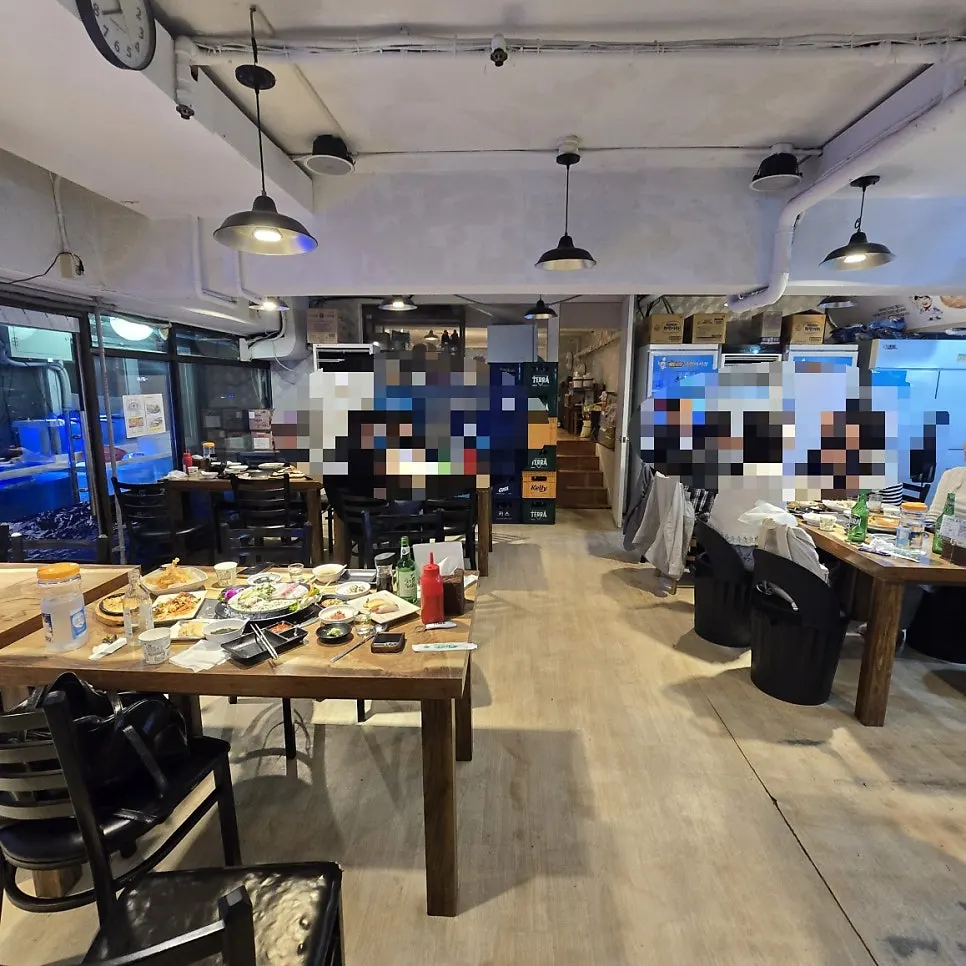 Dining hall mixing a pojangmacha vibe with modern interior