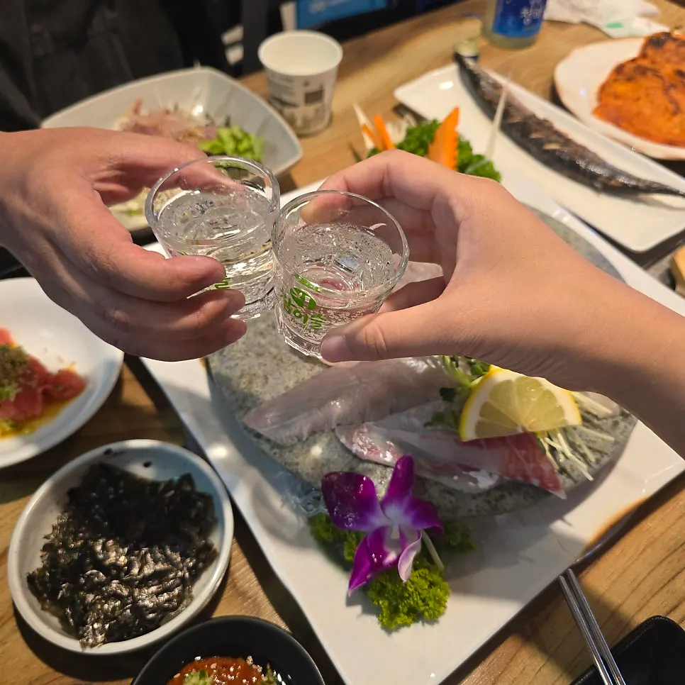 Raw fish anju paired with a shot of soju