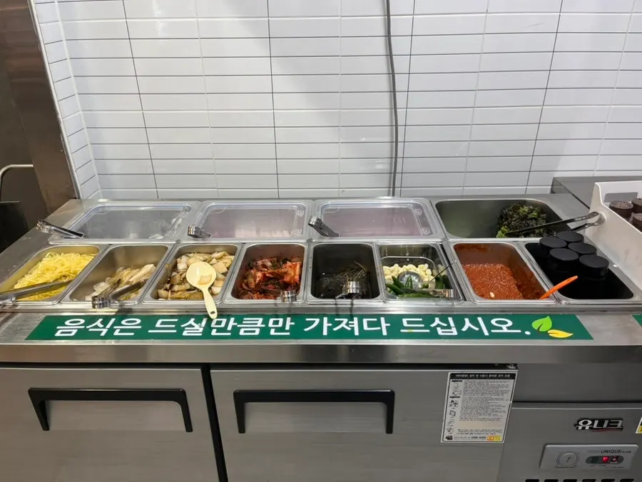 Eel wraps prepared with lettuce and white kimchi