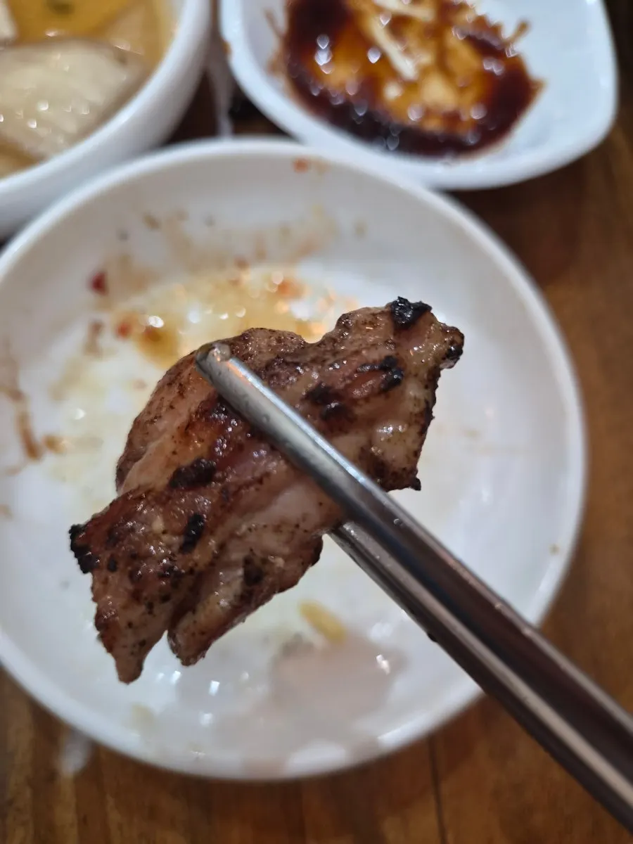 Chicken neck meat on the grill