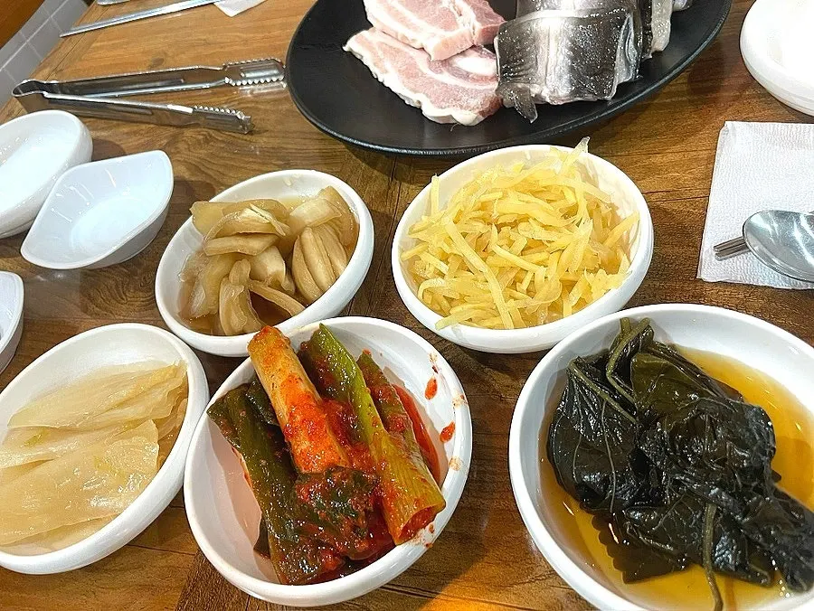 First table setting piled high with eel