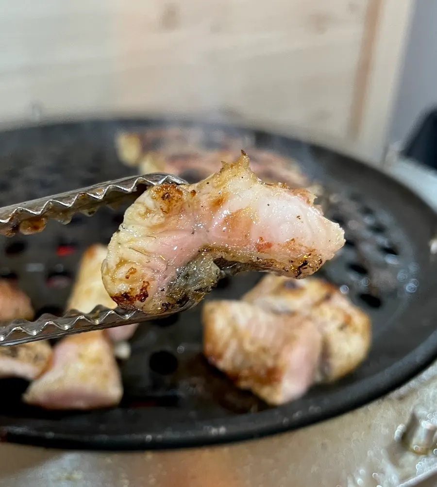 Thick freshwater eel grilling on the tabletop grill