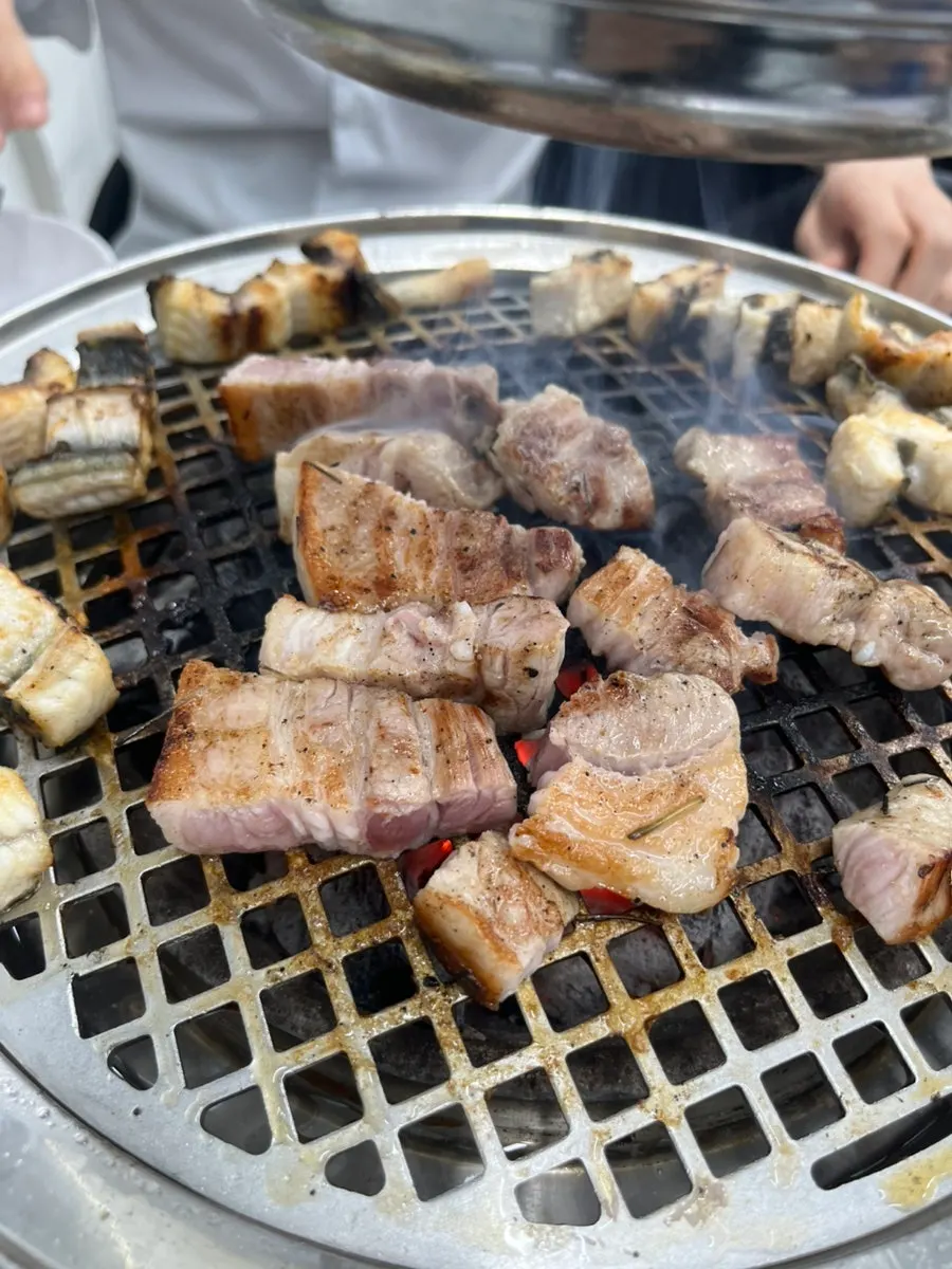 Pork belly cooking on the grill