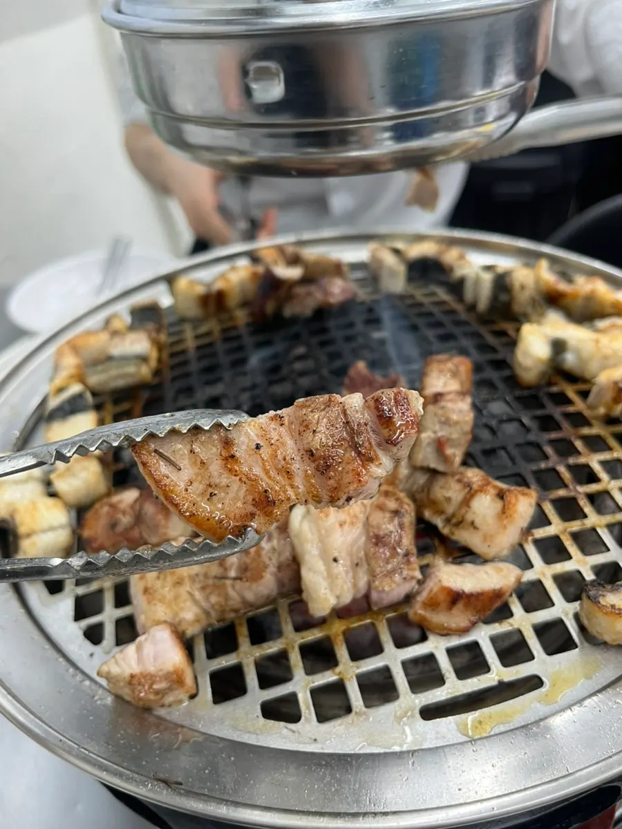 A golden-brown grilled piece of pork belly