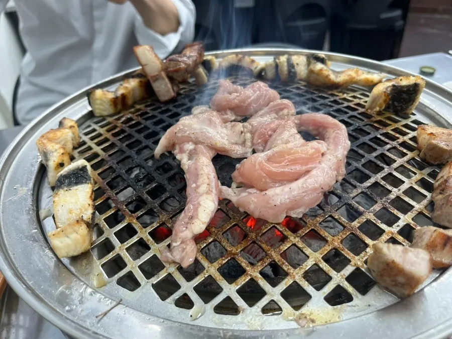 Chicken neck meat placed on the grill