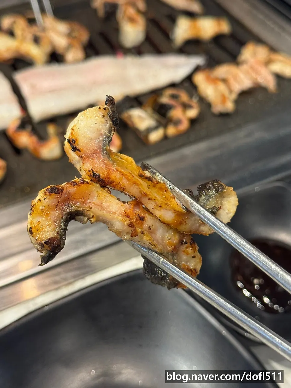 Eel cooking on the non-stick grill pan
