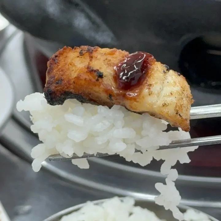 A piece of eel placed over rice