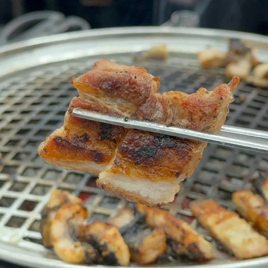 Pork belly grilled golden over charcoal