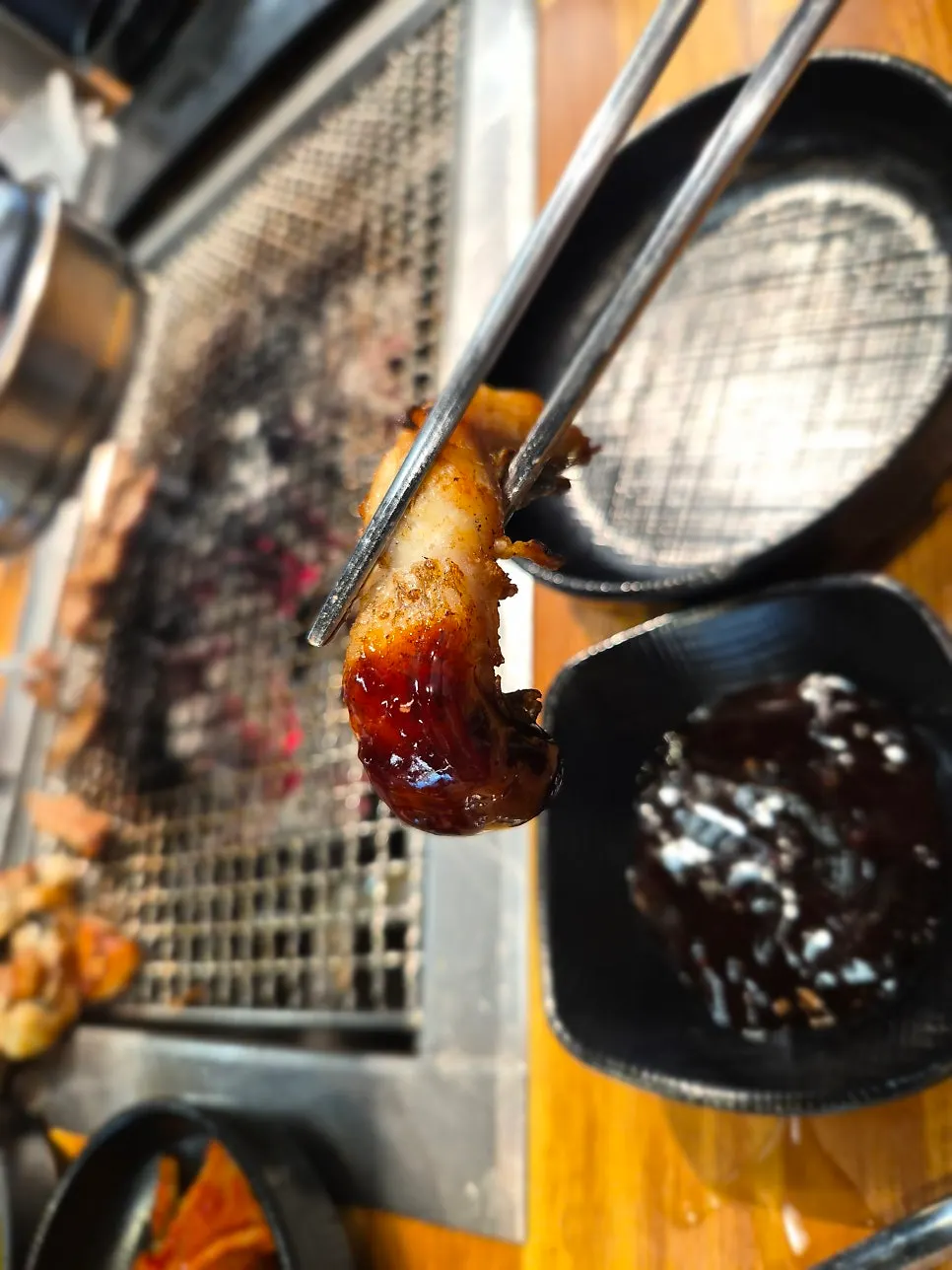 A bite of eel wrapped in lettuce