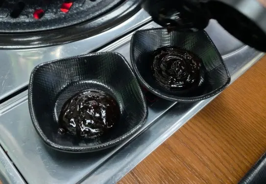 Eel sauce provided in a communal container