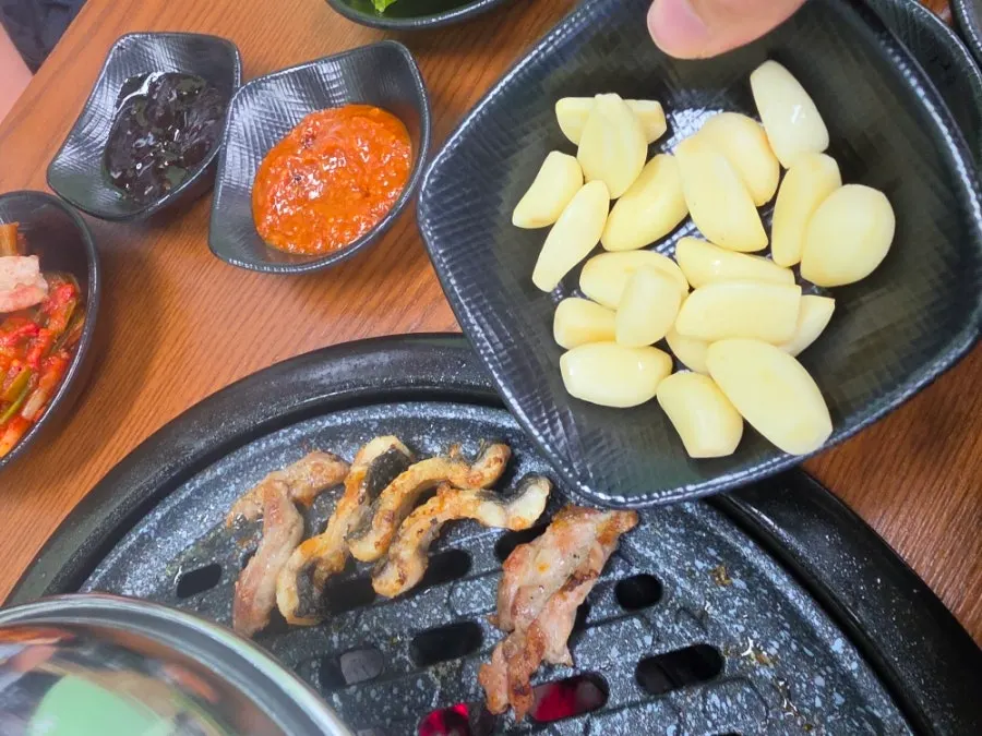 A piece of eel with ssam vegetables and garlic