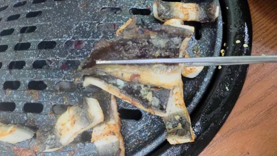 Grill loaded with thick eel pieces