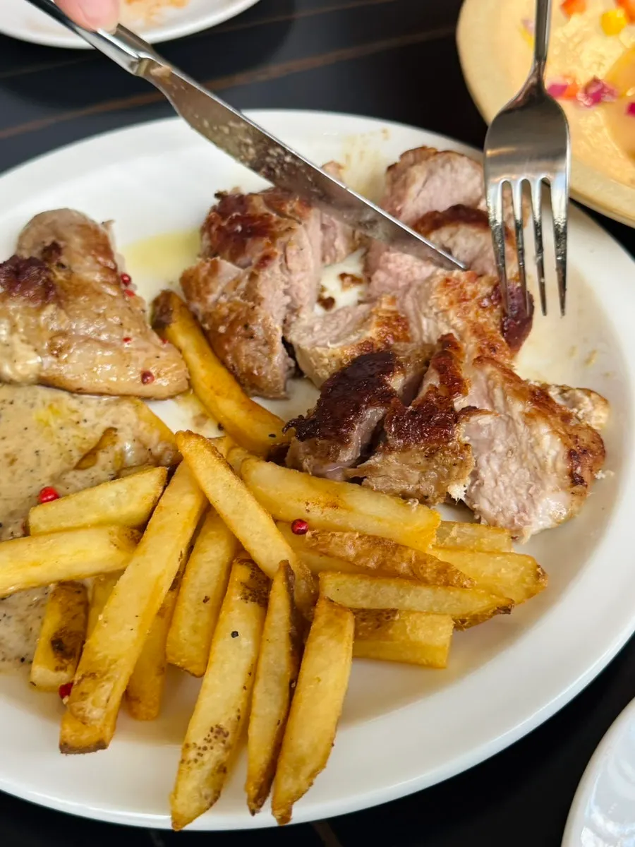 Creamy peppercorn sauce with the pork neck steak