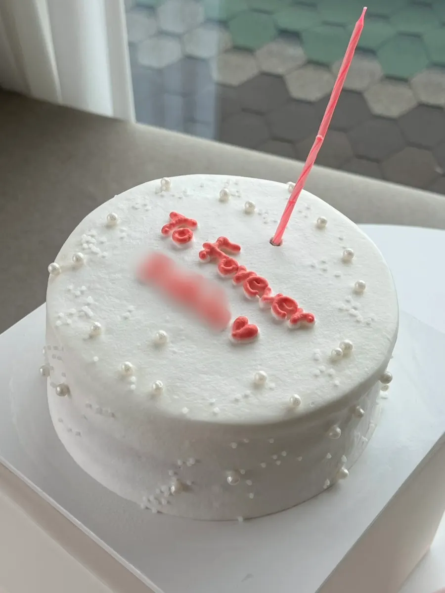 Handmade cakes and candles displayed inside the fridge