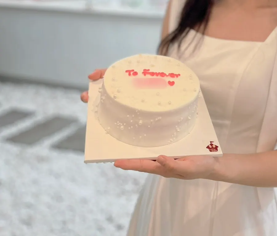 Cake placed alongside bridal shower props