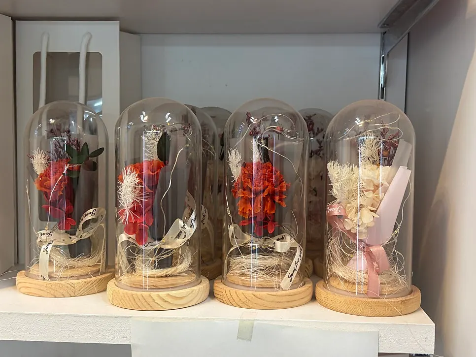 Flower gift in a glass dome