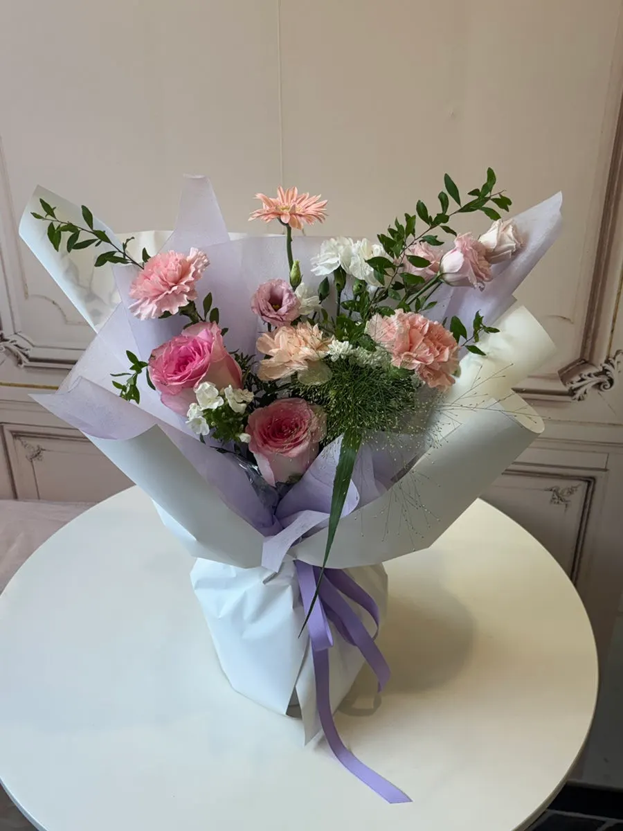 S-size bouquet in a clear shopping bag