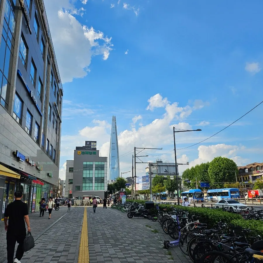 Street toward Songpa Station Exit 4 with Lotte Tower visible