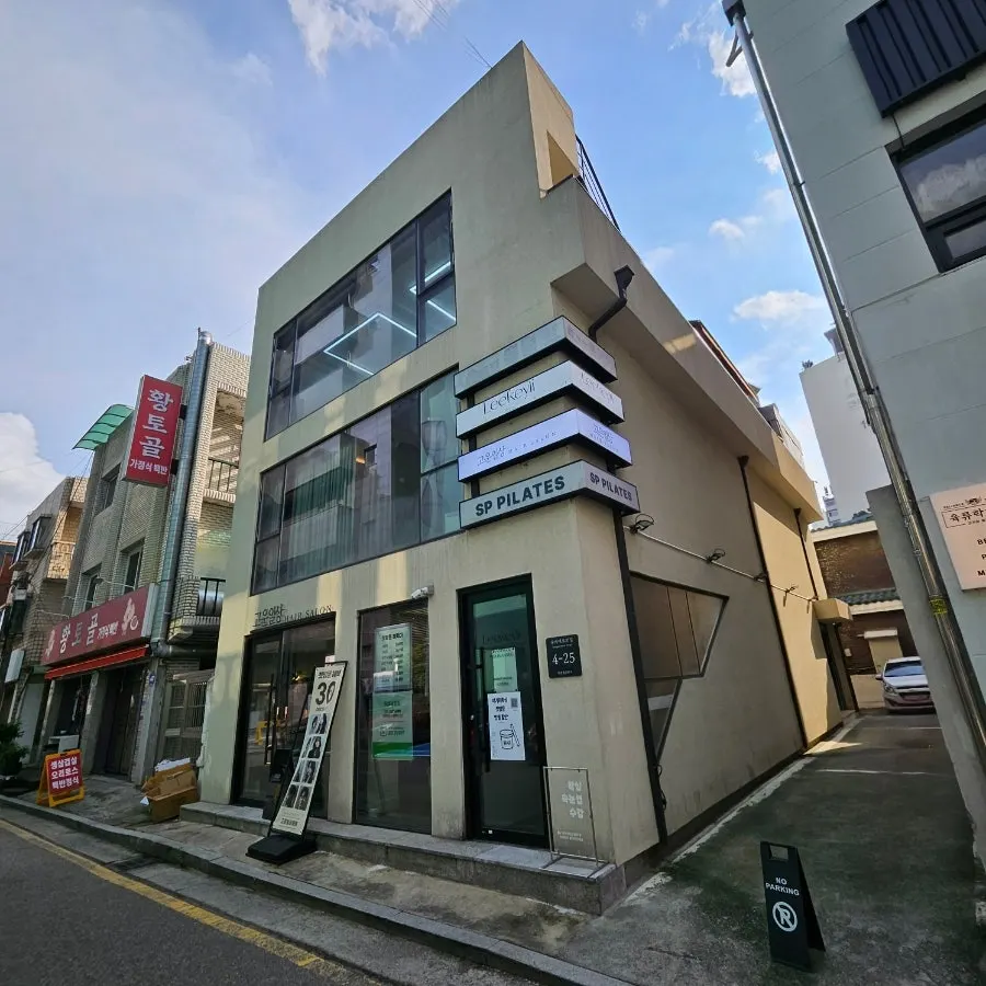 Exterior of the hair salon one block in from the main road