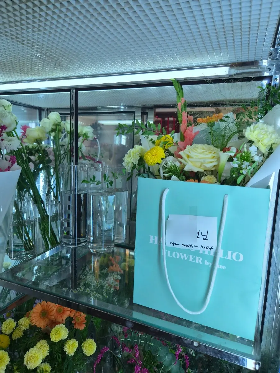 Flowers in different styles and green foliage
