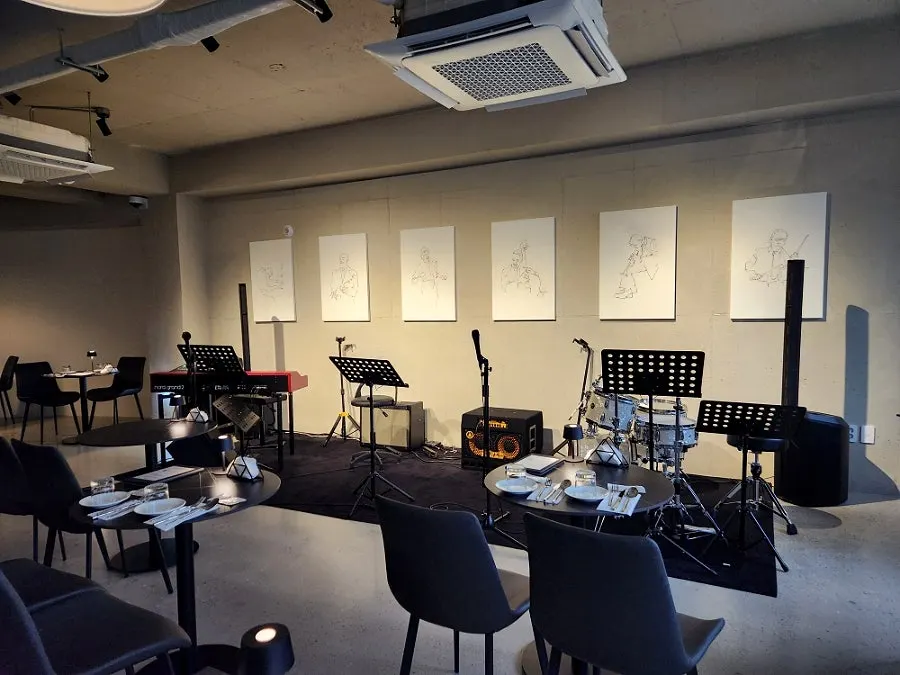 Jazz performance stage set up at the front of the hall