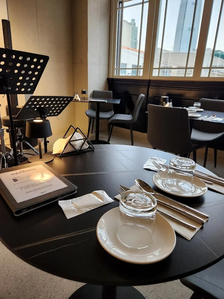 Table setting with tablet menu and utensils