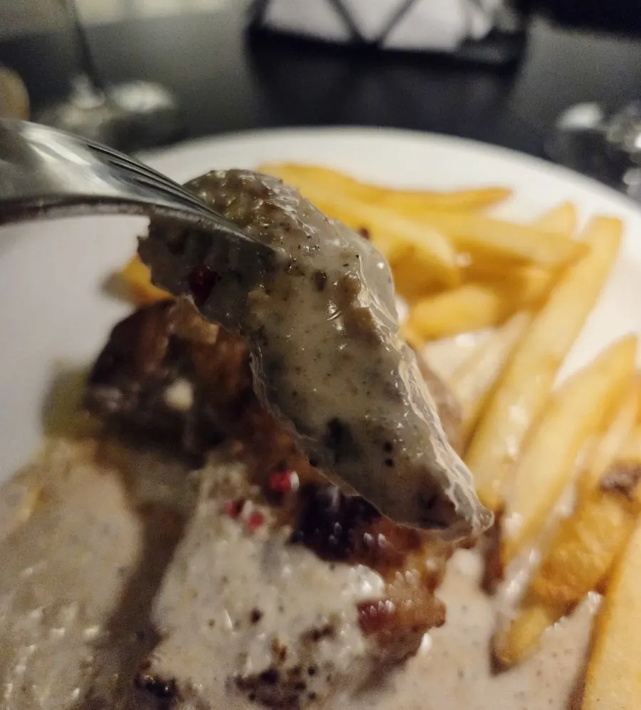 Pork-neck steak with cream sauce and fries