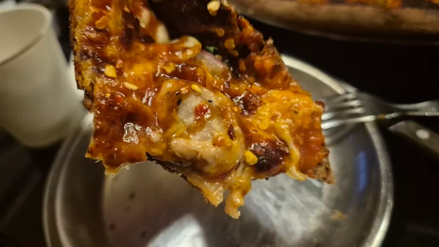 Chicken Never Sleeps pizza and accompaniments