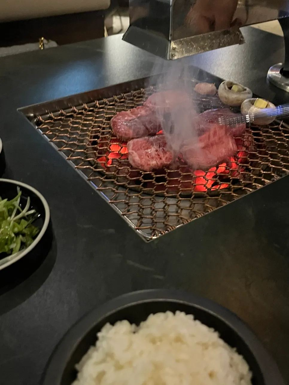 Beef browning nicely over the charcoal fire