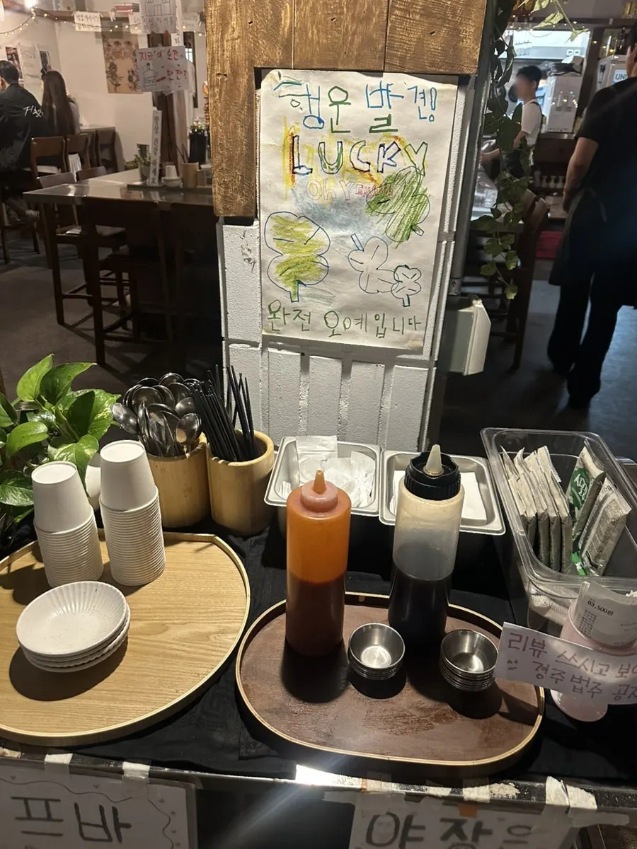 Daegang's indoor bar counter and table seating with wood interior