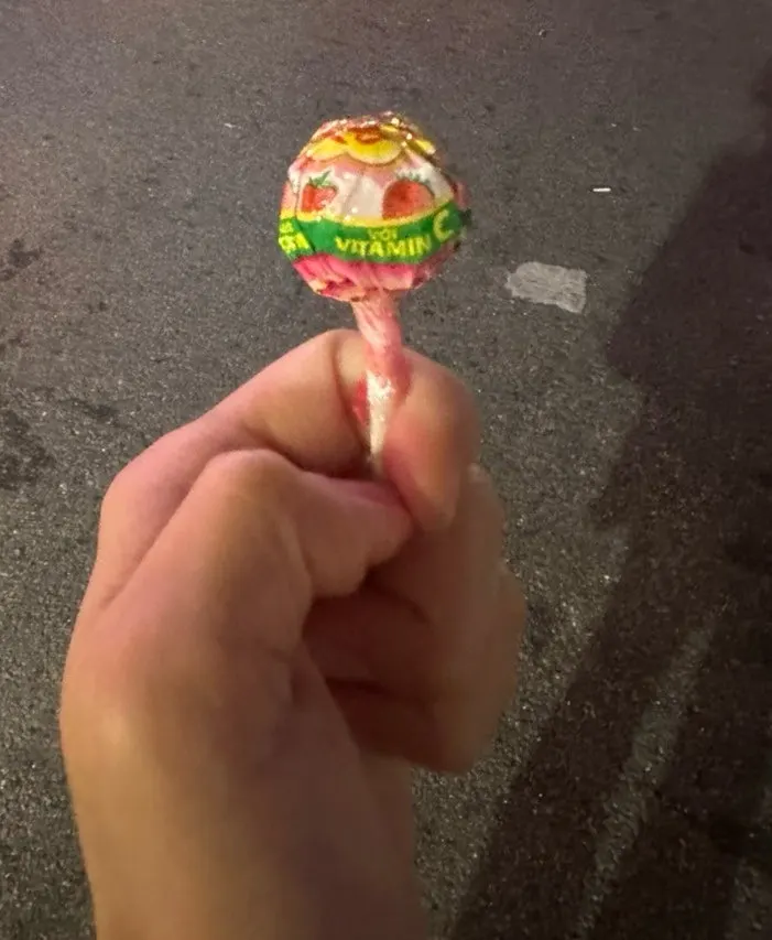 A strawberry cream flavored Chupa Chups given on the way out