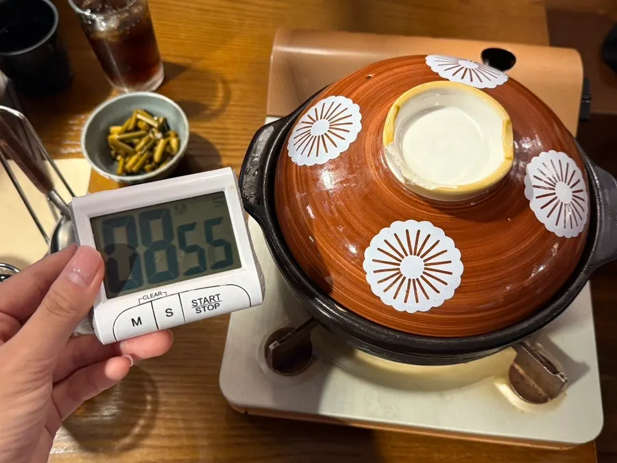 Beef gopchang hot pot starting to boil in an earthenware pot