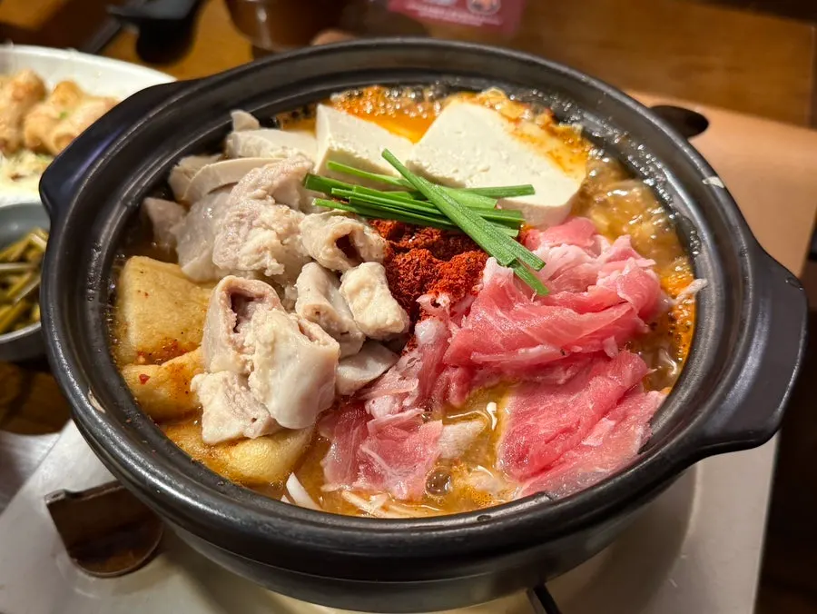 Beef gopchang hot pot loaded with tofu, fried tofu, and fish balls