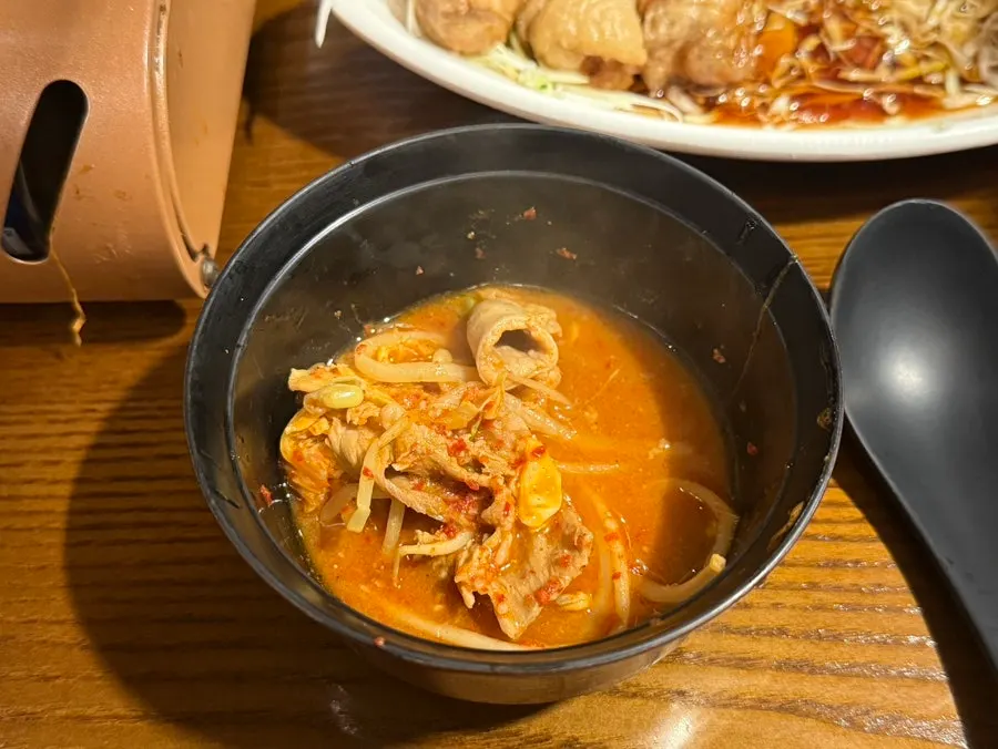 Gopchang and vegetables served on a small plate