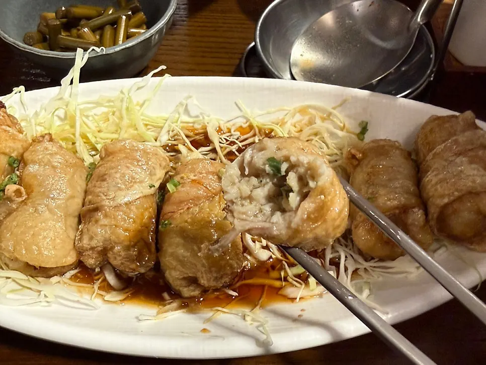 A plate of crispy fried chicken skin gyoza