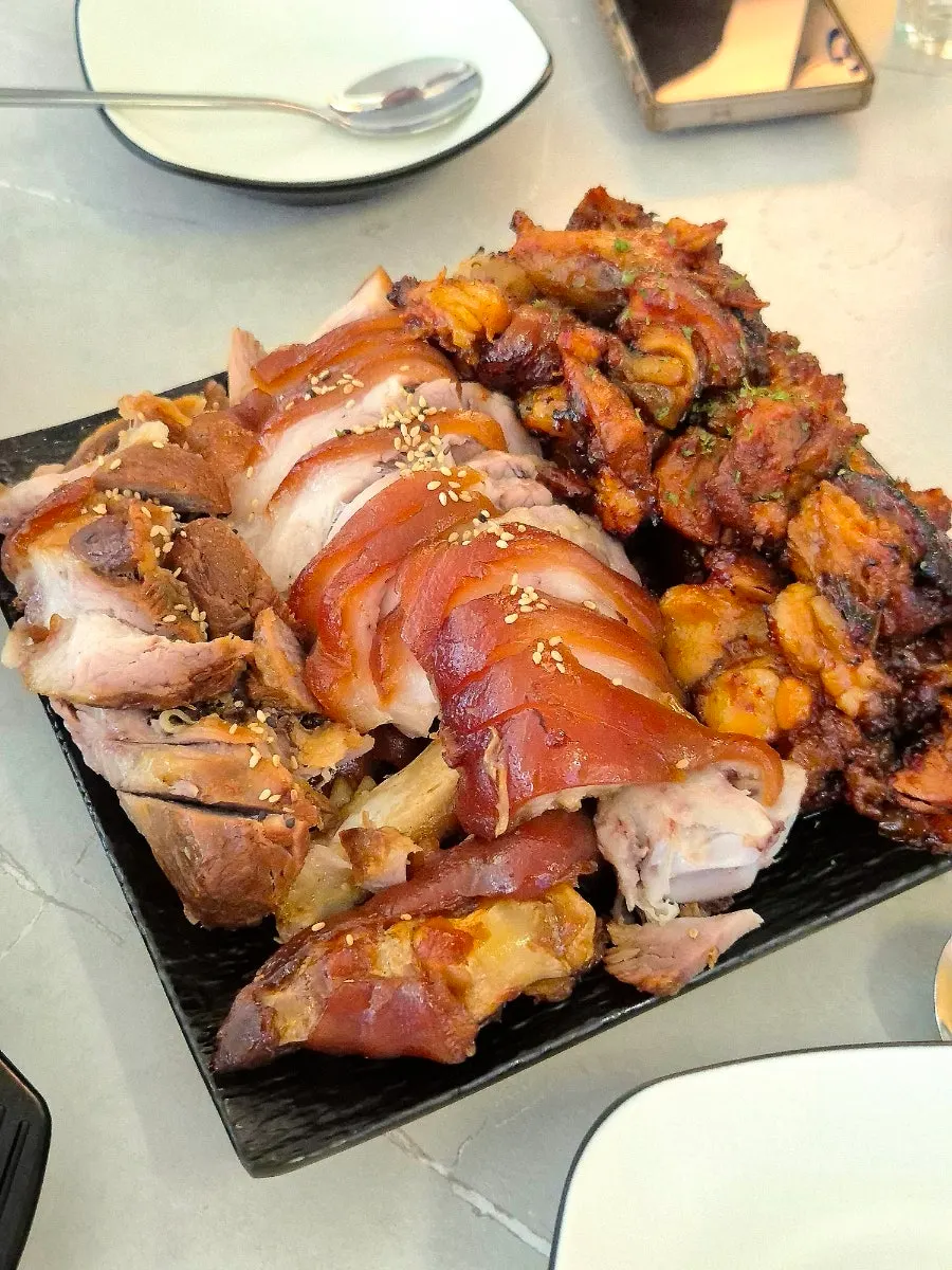 A plate with fire jokbal and regular jokbal side by side