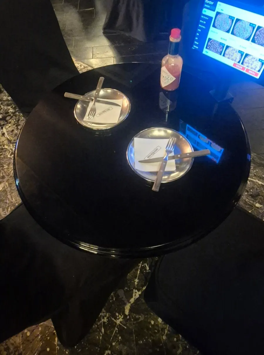 Table set with stainless steel plates, forks, and knives