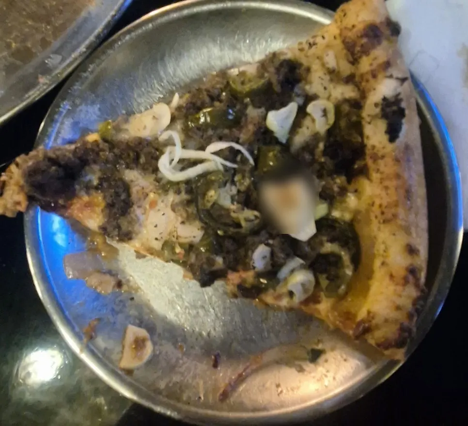 Cross-section of a lifted slice of Beef Never Sleeps