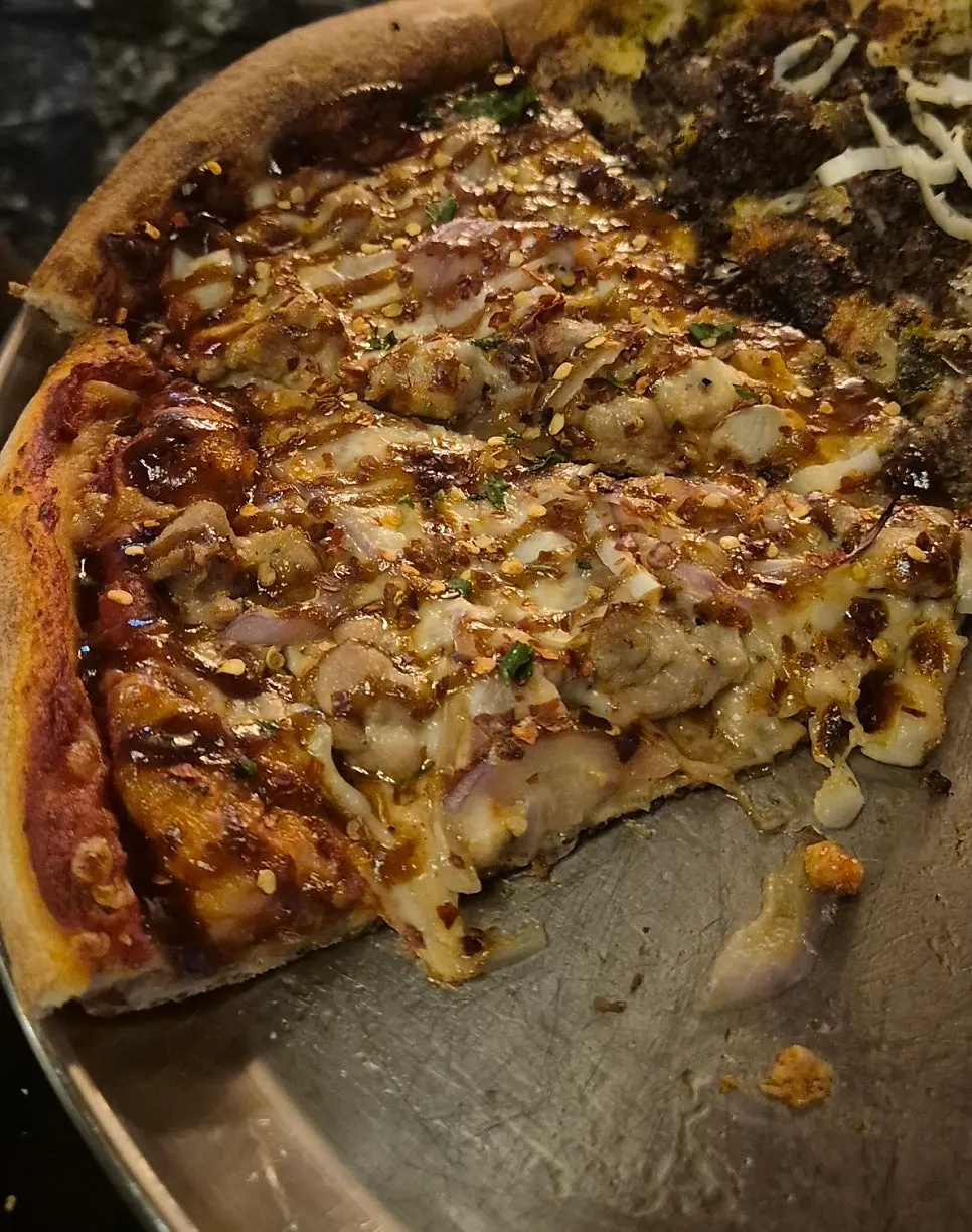 Chicken Never Sleeps topped with chicken meat