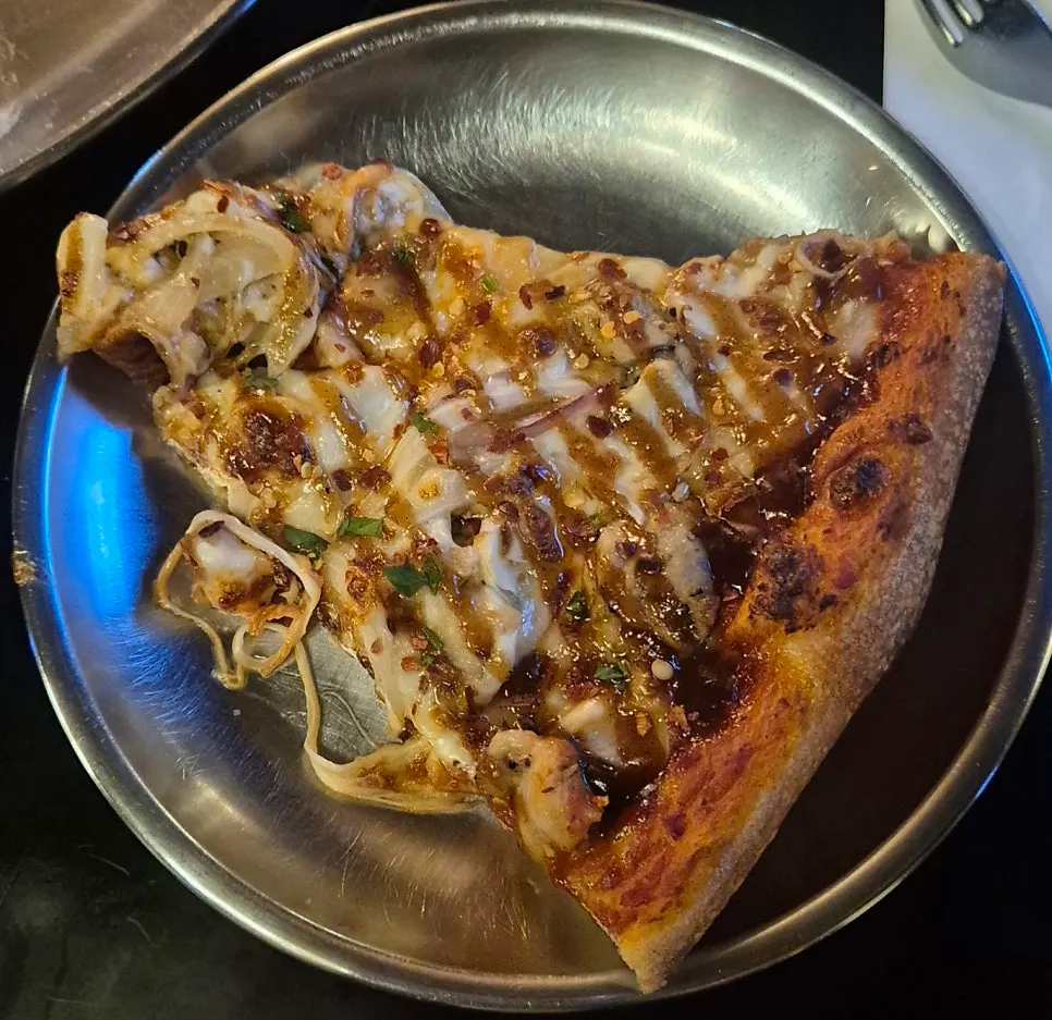 Close-up of Chicken Never Sleeps toppings