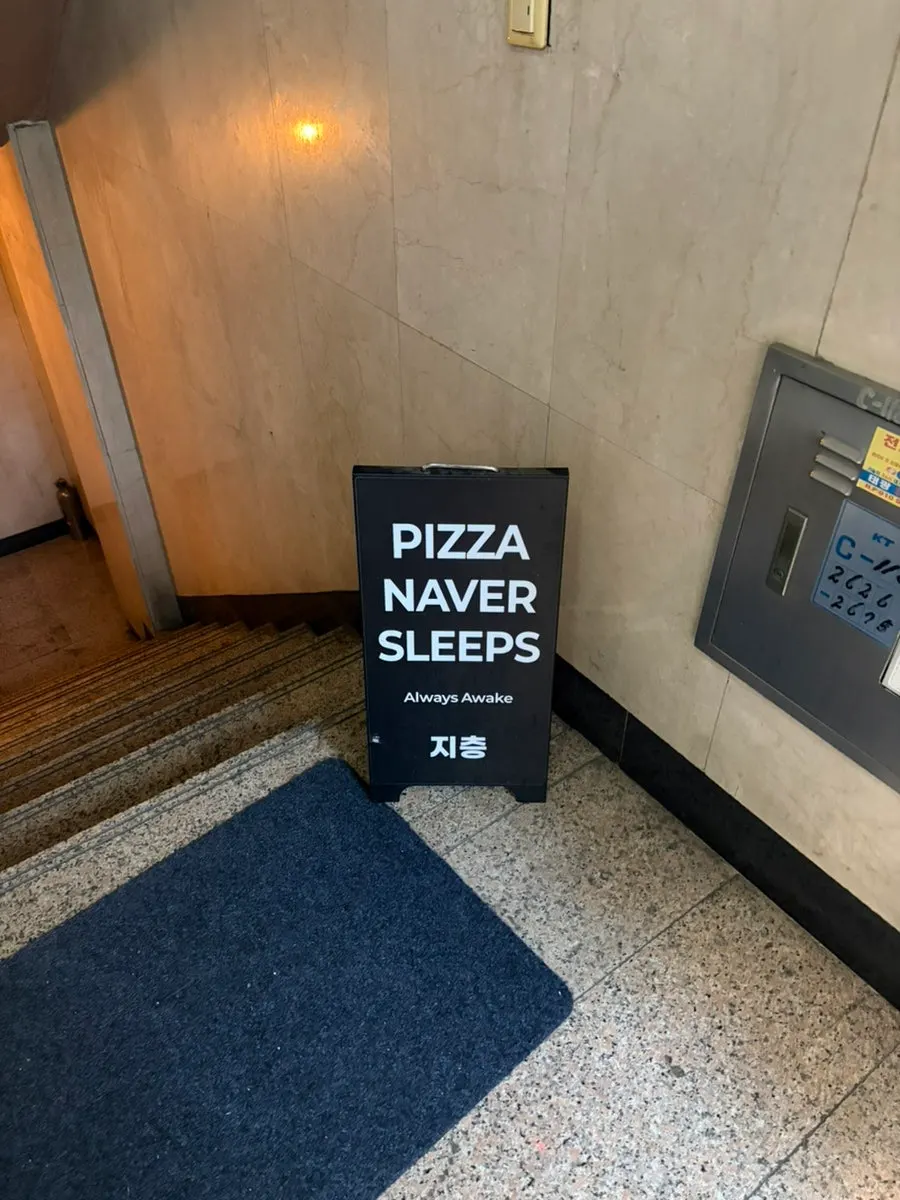 Sign directing down to the basement level store